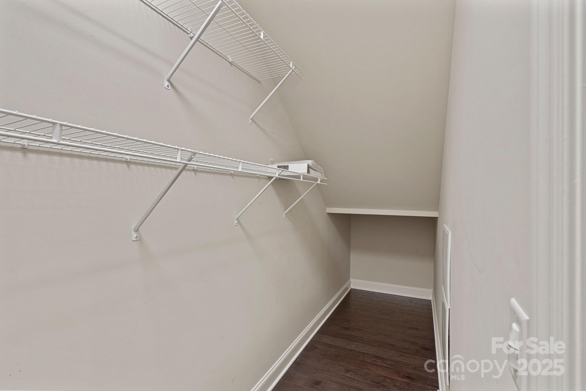 16909 Setter Point Lane Davidson, NC 28036 - Photo 6 of 45 a view of a room with racks on the wall