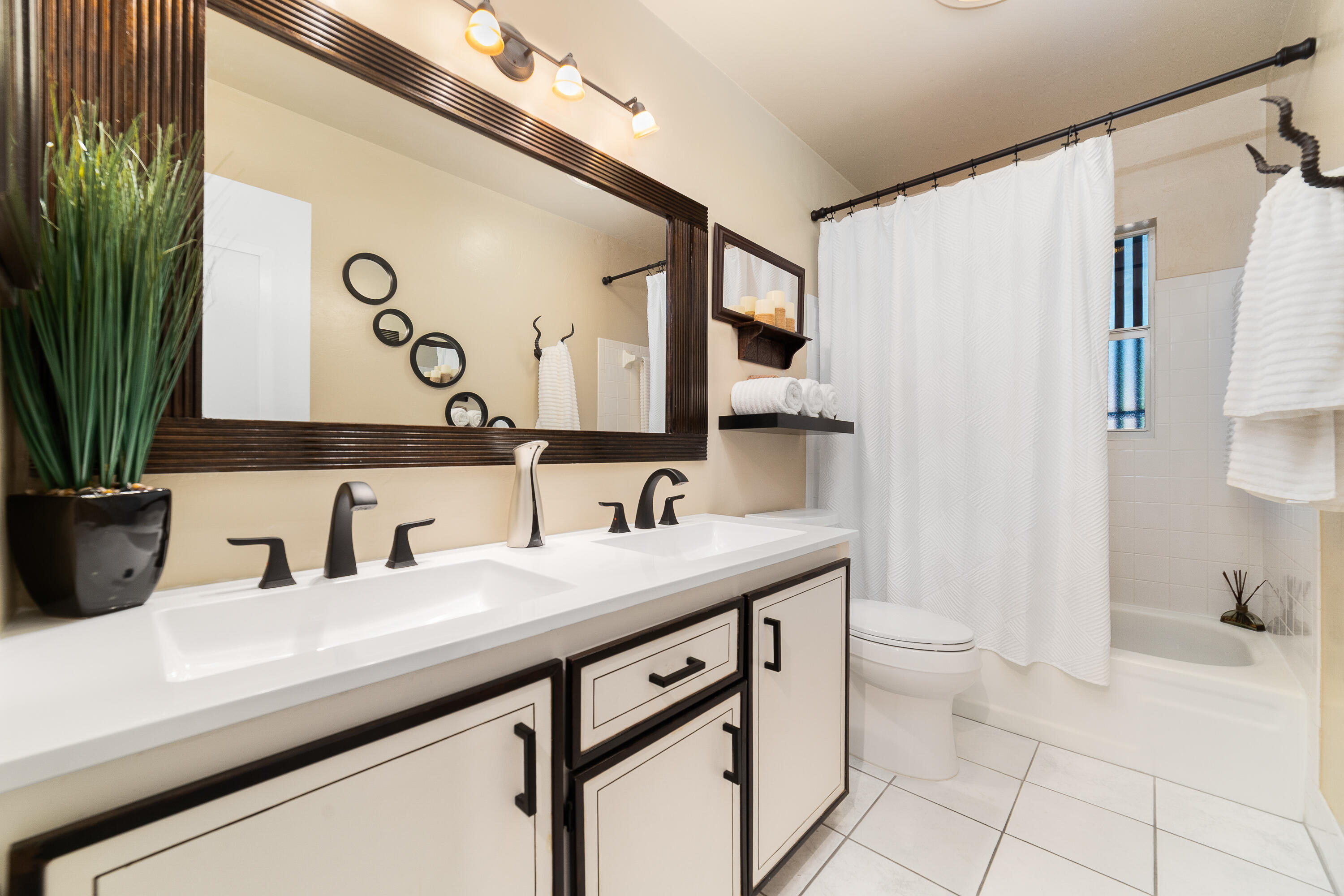 1721 Southwest 9th Street Boca Raton, FL 33486 - Photo 18 of 40 a bathroom with a sink and a mirror