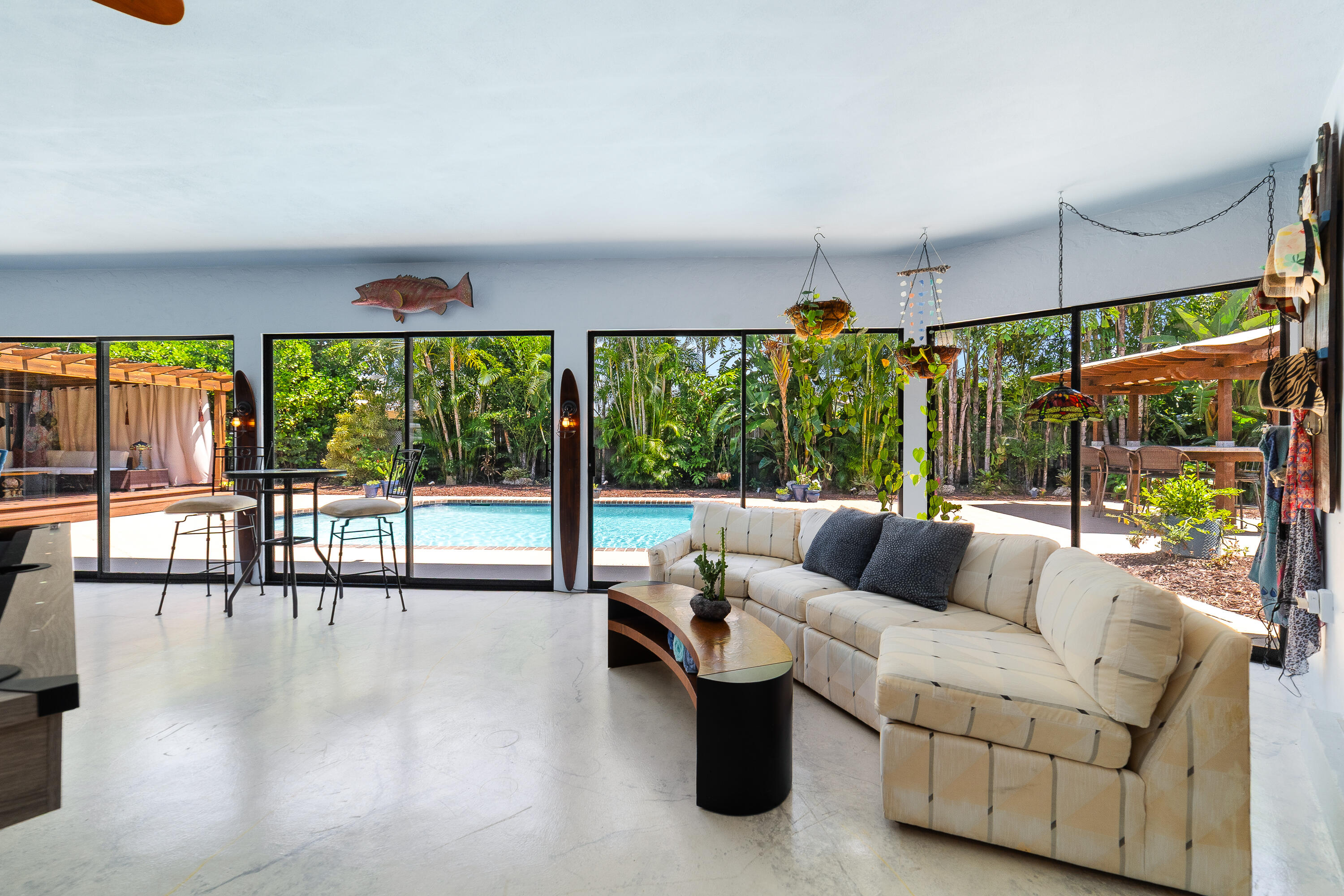 1721 Southwest 9th Street Boca Raton, FL 33486 - Photo 21 of 40 a living room with furniture and a floor to ceiling window