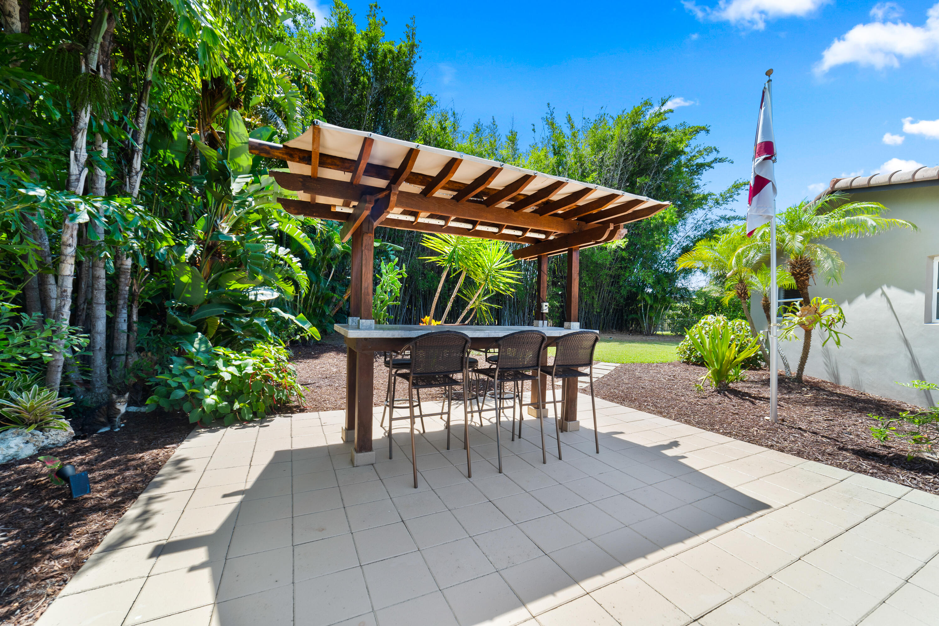 1721 Southwest 9th Street Boca Raton, FL 33486 - Photo 26 of 40 an outdoor space with furniture and umbrella