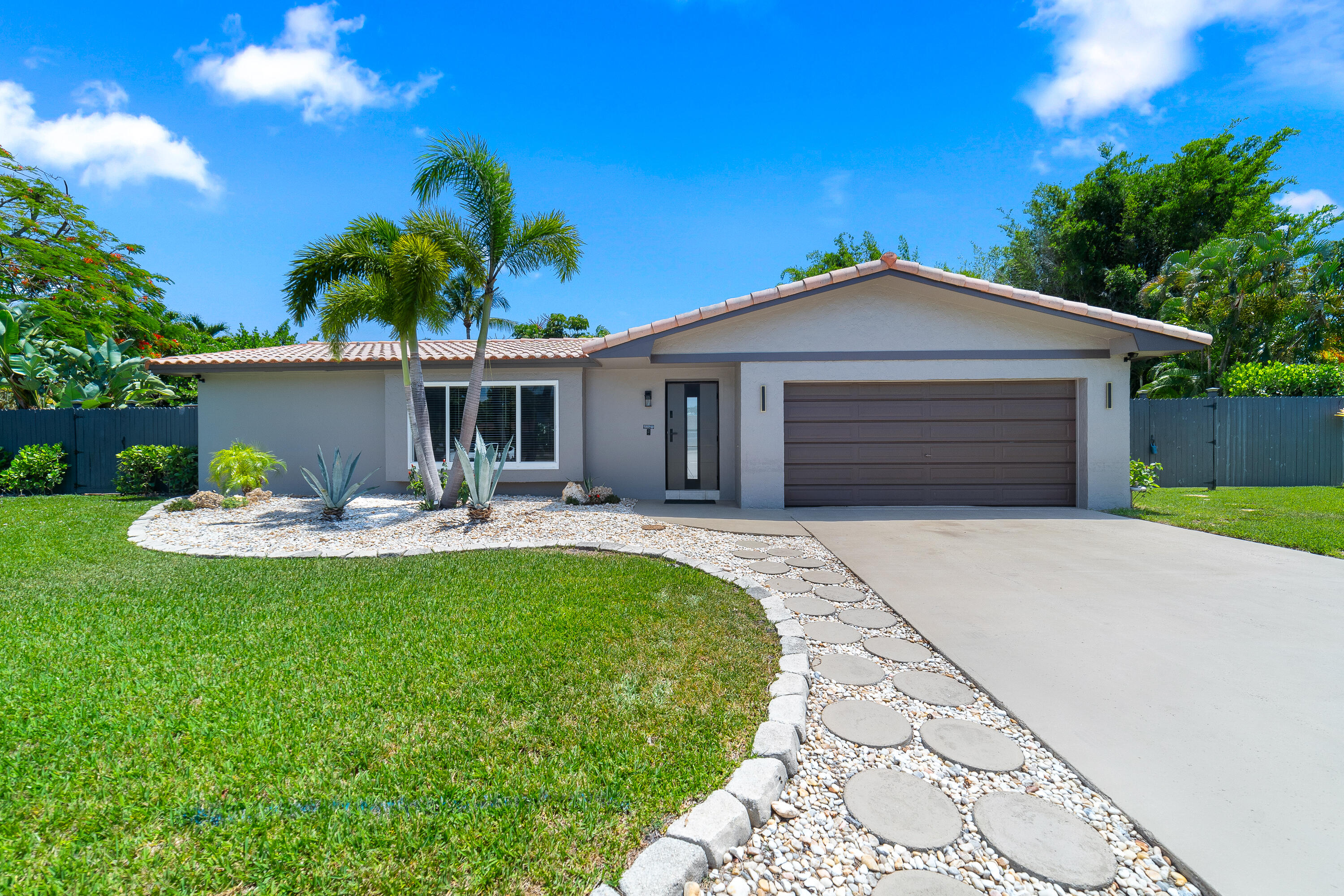 1721 Southwest 9th Street Boca Raton, FL 33486 - Photo 35 of 40 a front view of a house with garden