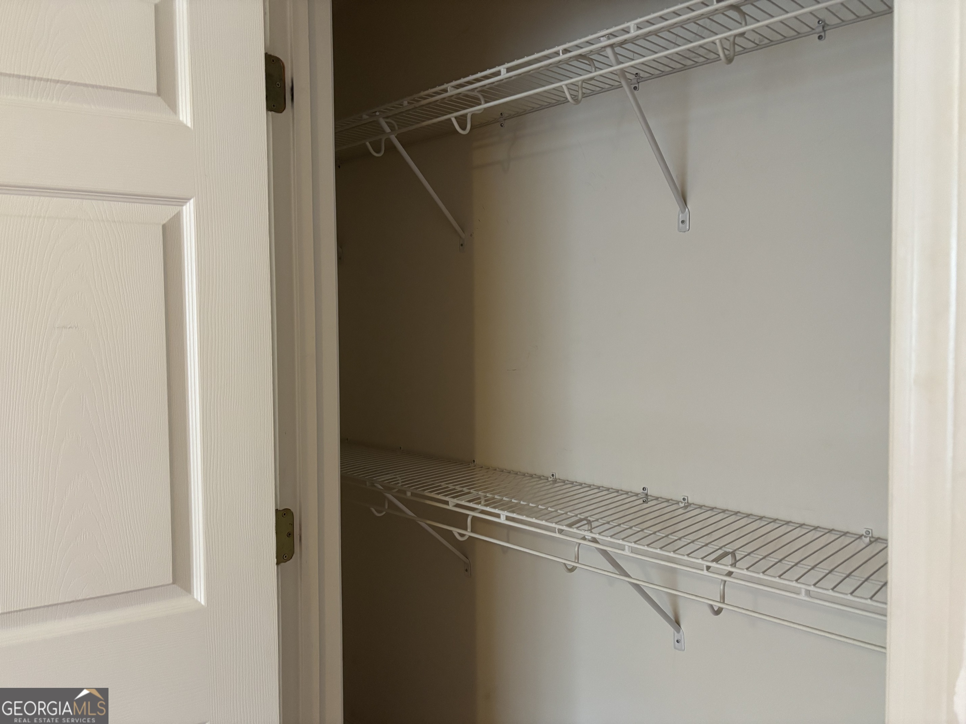12 Intown Place Fayetteville, GA 30214 - Photo 11 of 12 a view of a room with racks on the wall
