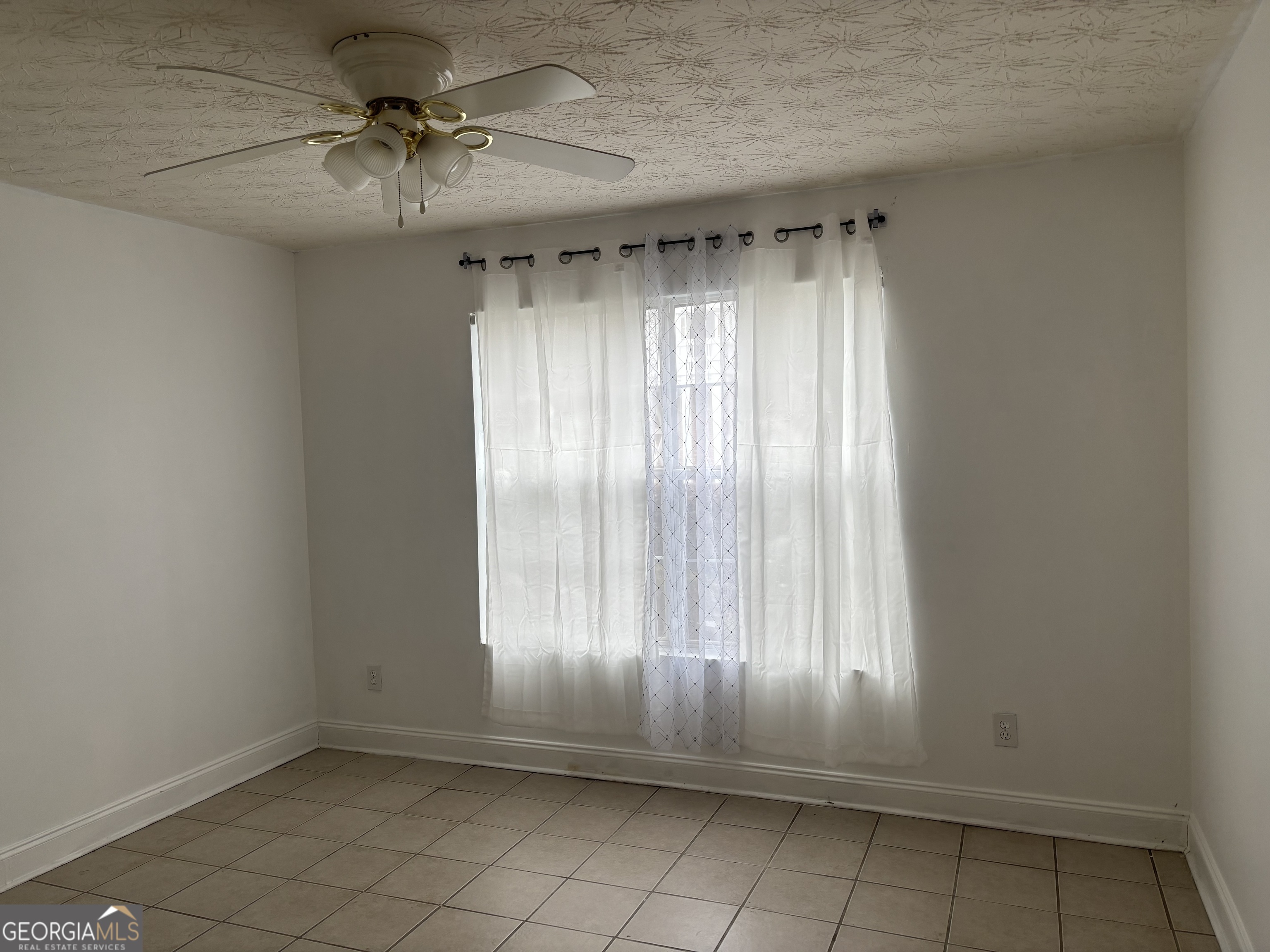 12 Intown Place Fayetteville, GA 30214 - Photo 8 of 12 an empty room with a empty space and windows