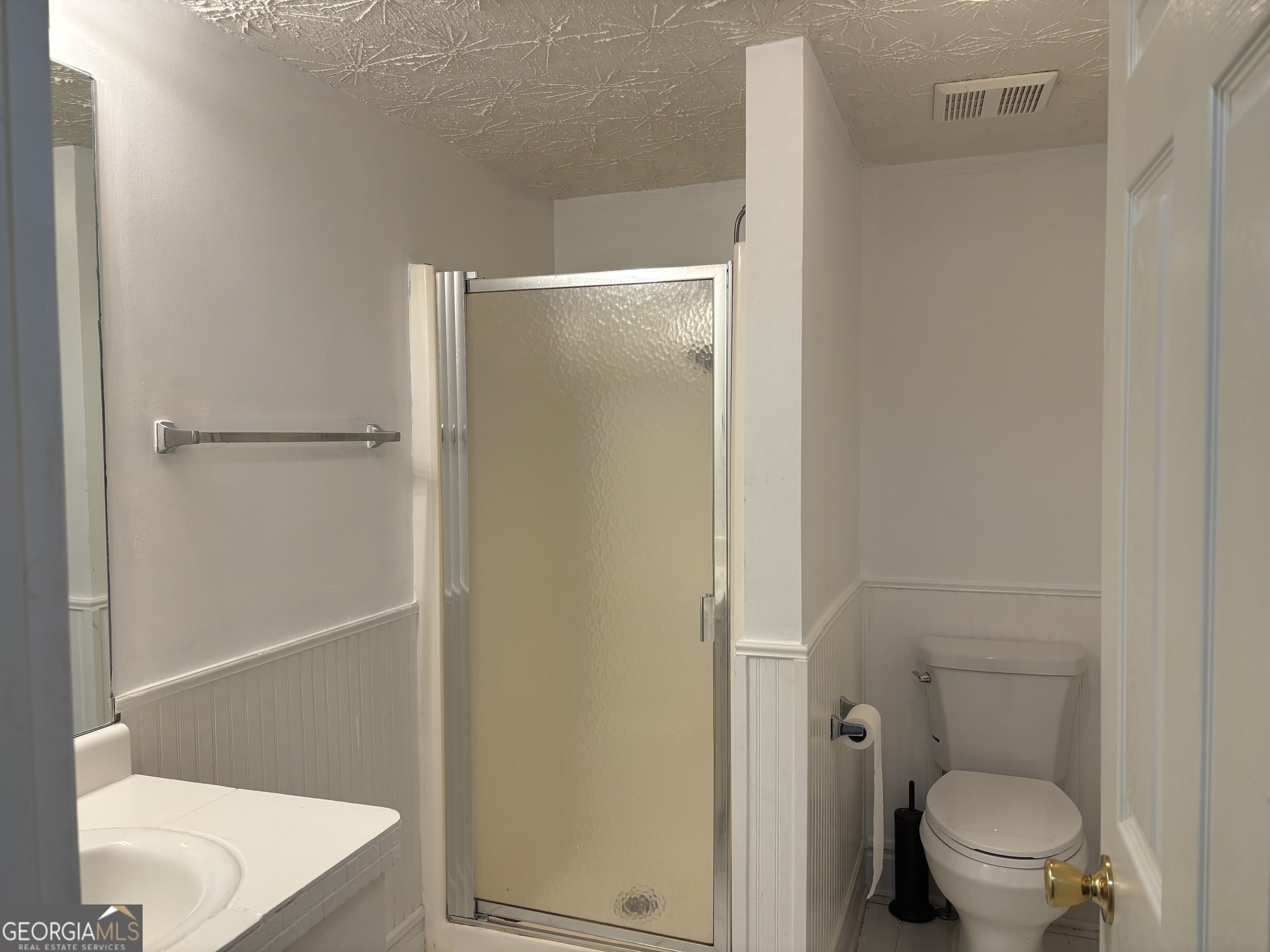 12 Intown Place Fayetteville, GA 30214 - Photo 9 of 12 a bathroom with a shower and a toilet