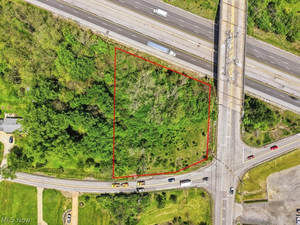 V/l West Edgerton Road Broadview Heights, OH 44147 - Photo 2 of 5 Expansive undeveloped parcel outlined in red, featuring mature trees and natural vegetation