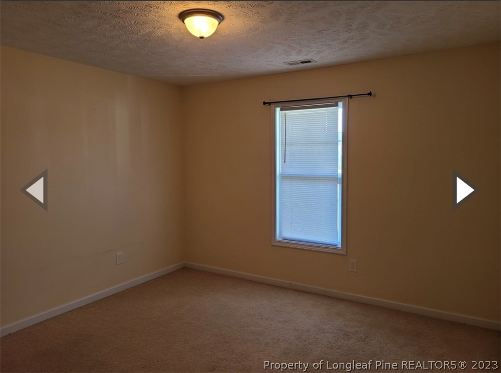 141 Roanoke Drive Raeford, NC 28376 - Photo 12 of 16 an empty room with a window