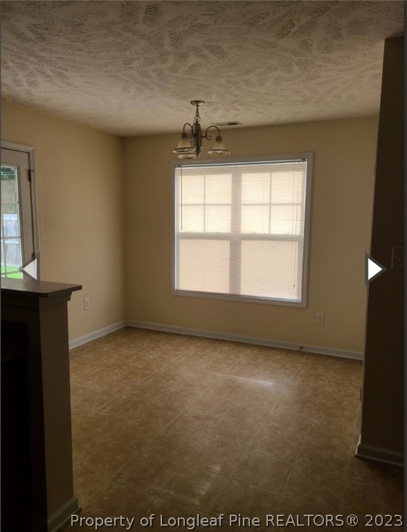 141 Roanoke Drive Raeford, NC 28376 - Photo 8 of 16 a view of an empty room with a window