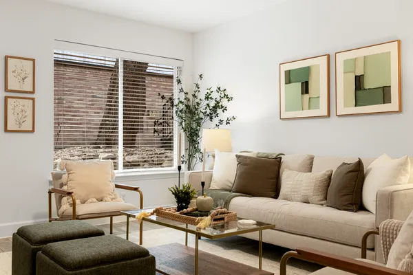 a living room with furniture and a window