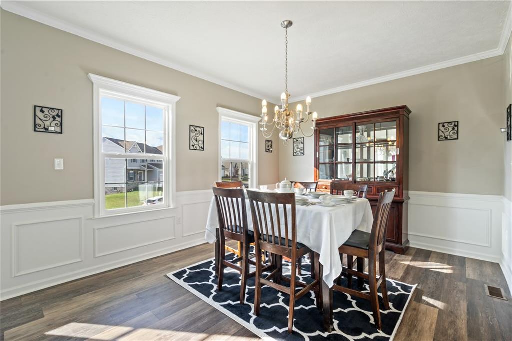 216 West Country Barn Road Houston, PA 15342 - Photo 13 of 34 a view of a dining room with furniture window and wooden floor