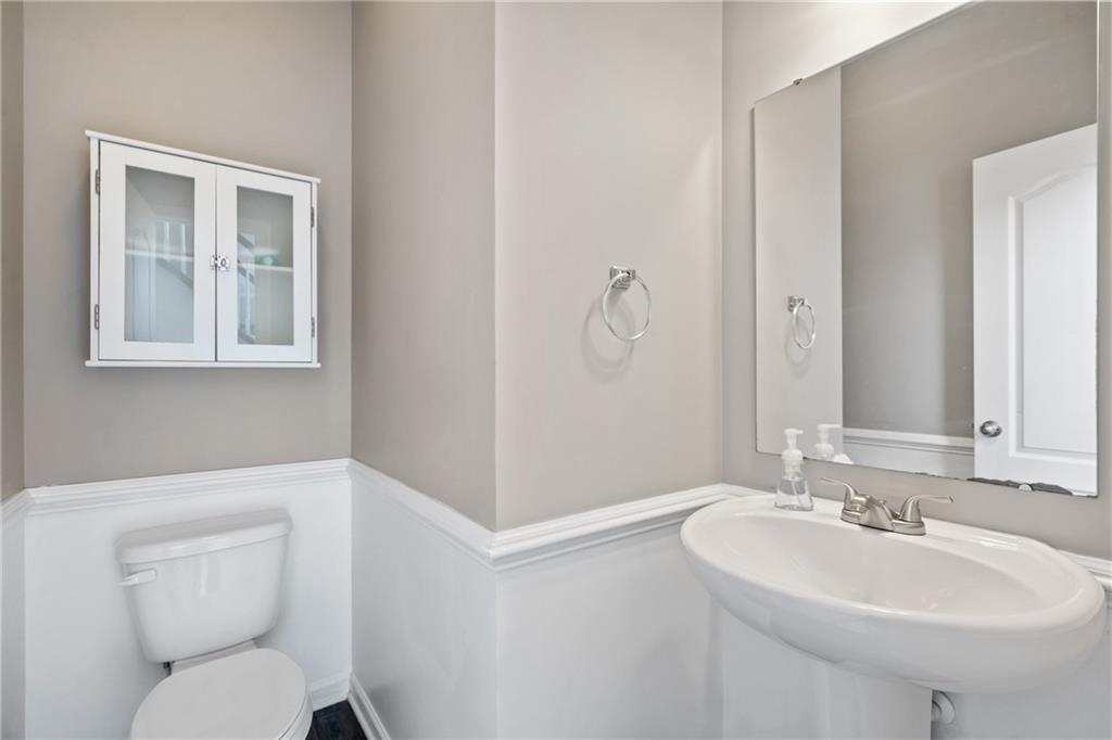 216 West Country Barn Road Houston, PA 15342 - Photo 18 of 34 a bathroom with a toilet sink and mirror