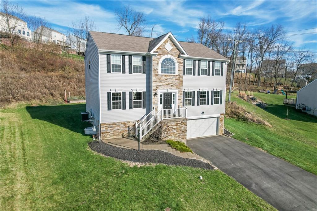 216 West Country Barn Road Houston, PA 15342 - Photo 2 of 34 front view of a house with a yard