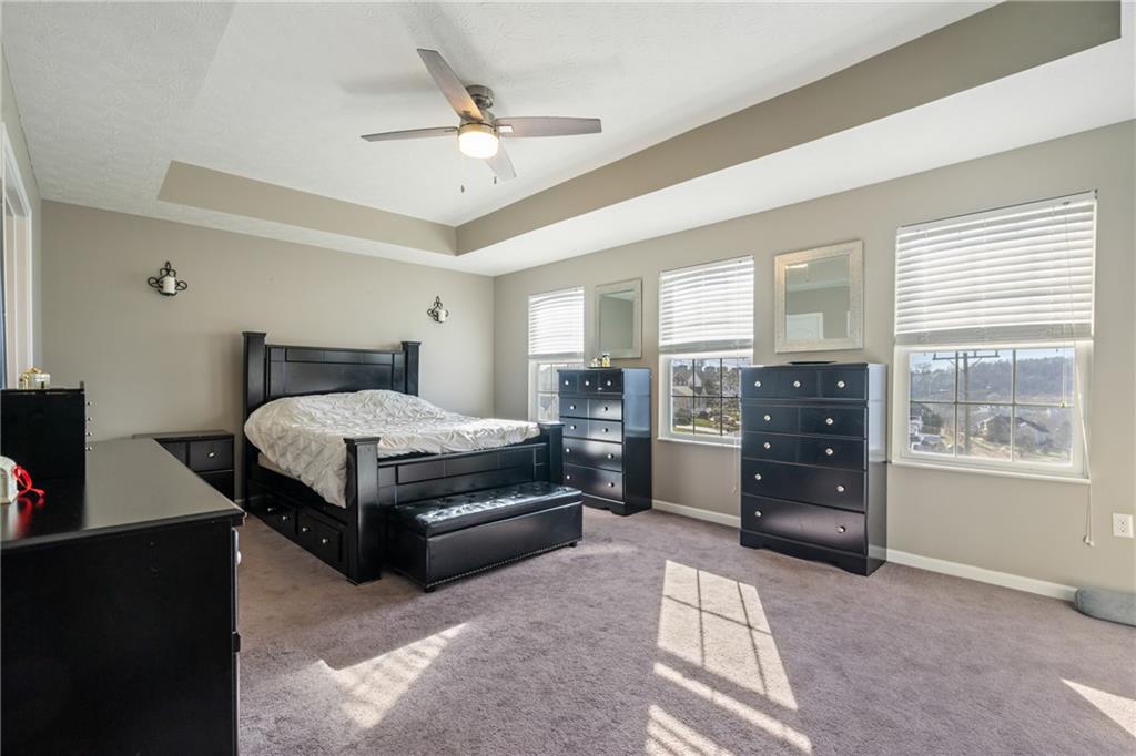 216 West Country Barn Road Houston, PA 15342 - Photo 26 of 34 a bedroom with a bed and ceiling fan