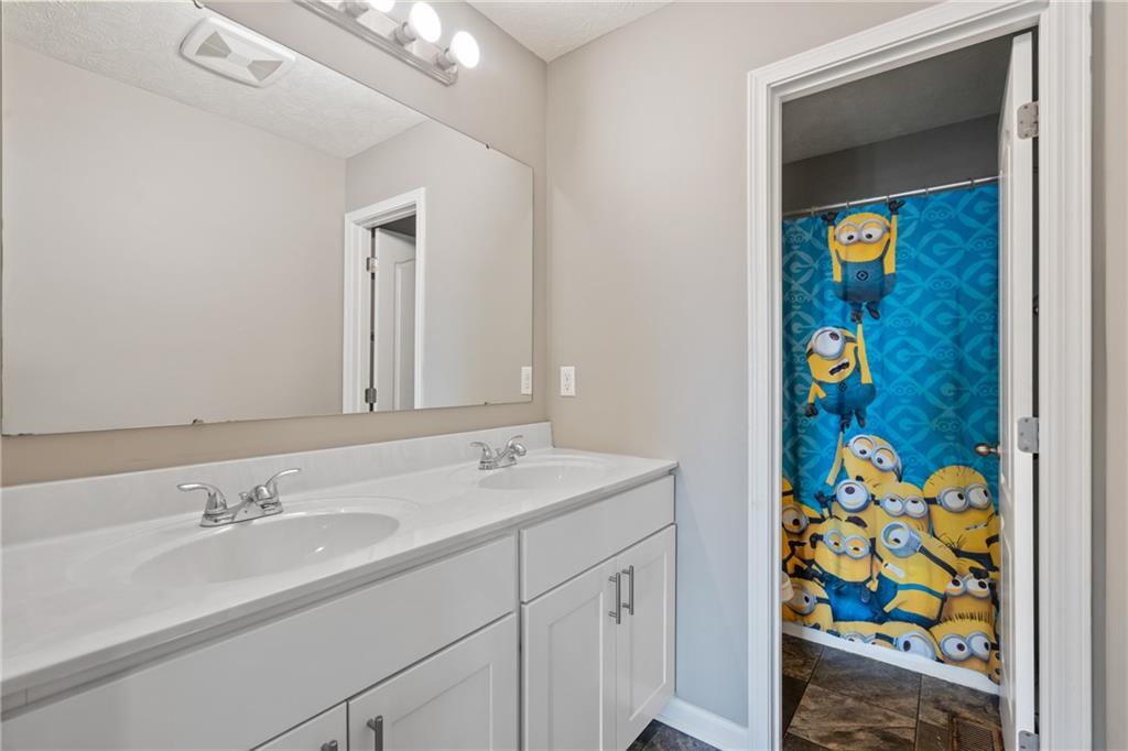 216 West Country Barn Road Houston, PA 15342 - Photo 31 of 34 a bathroom with a sink and a mirror