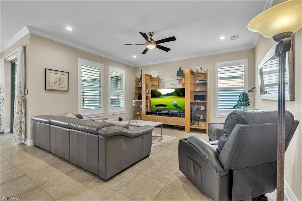 16424 Windsor Way Alva, FL 33920 - Photo 9 of 48 a living room with furniture and a flat screen tv