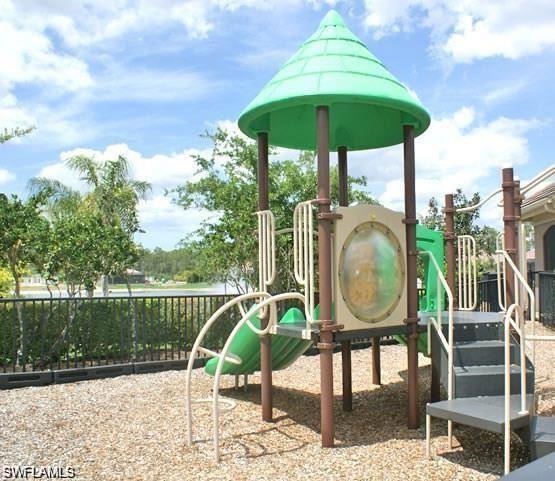 7414 Acorn Way Naples, FL 34119 - Photo 14 of 24 a view of a chair and tables in the patio