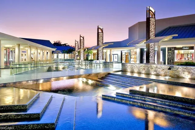 a view of a balcony with wooden floor and fence