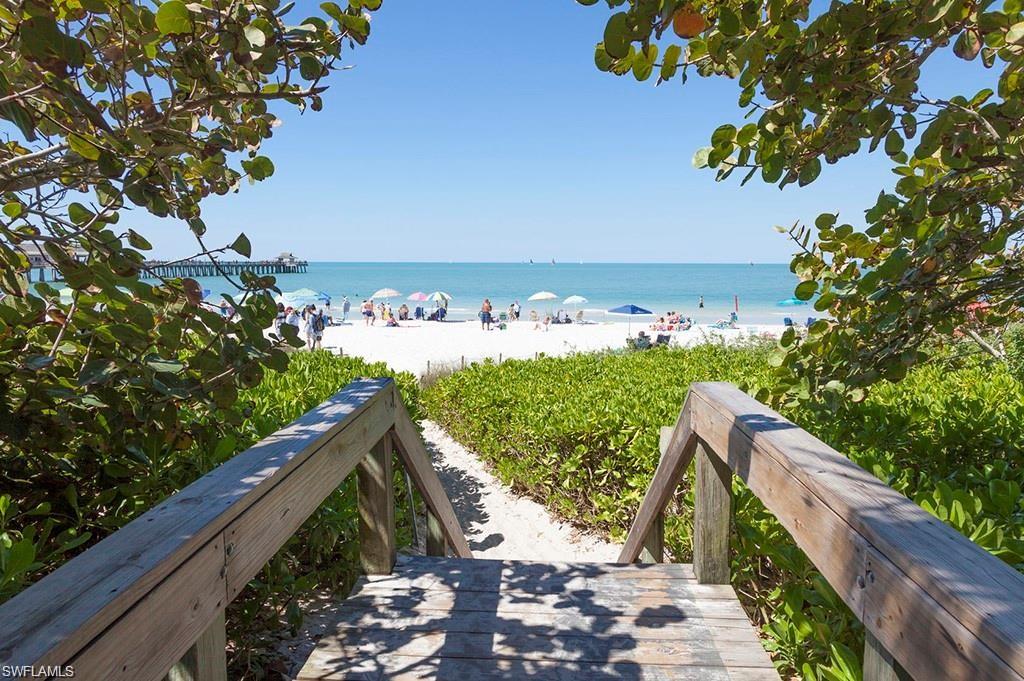 7414 Acorn Way Naples, FL 34119 - Photo 19 of 24 a view of a balcony with wooden floor and fence