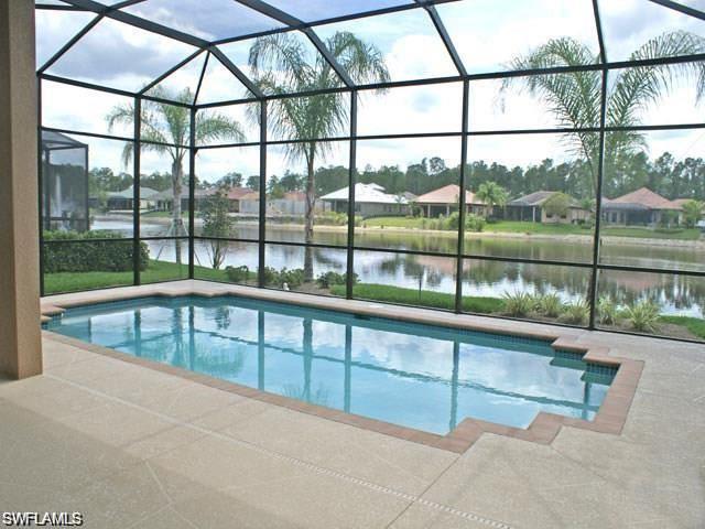 7414 Acorn Way Naples, FL 34119 - Photo 2 of 24 swimming pool view with outdoor space