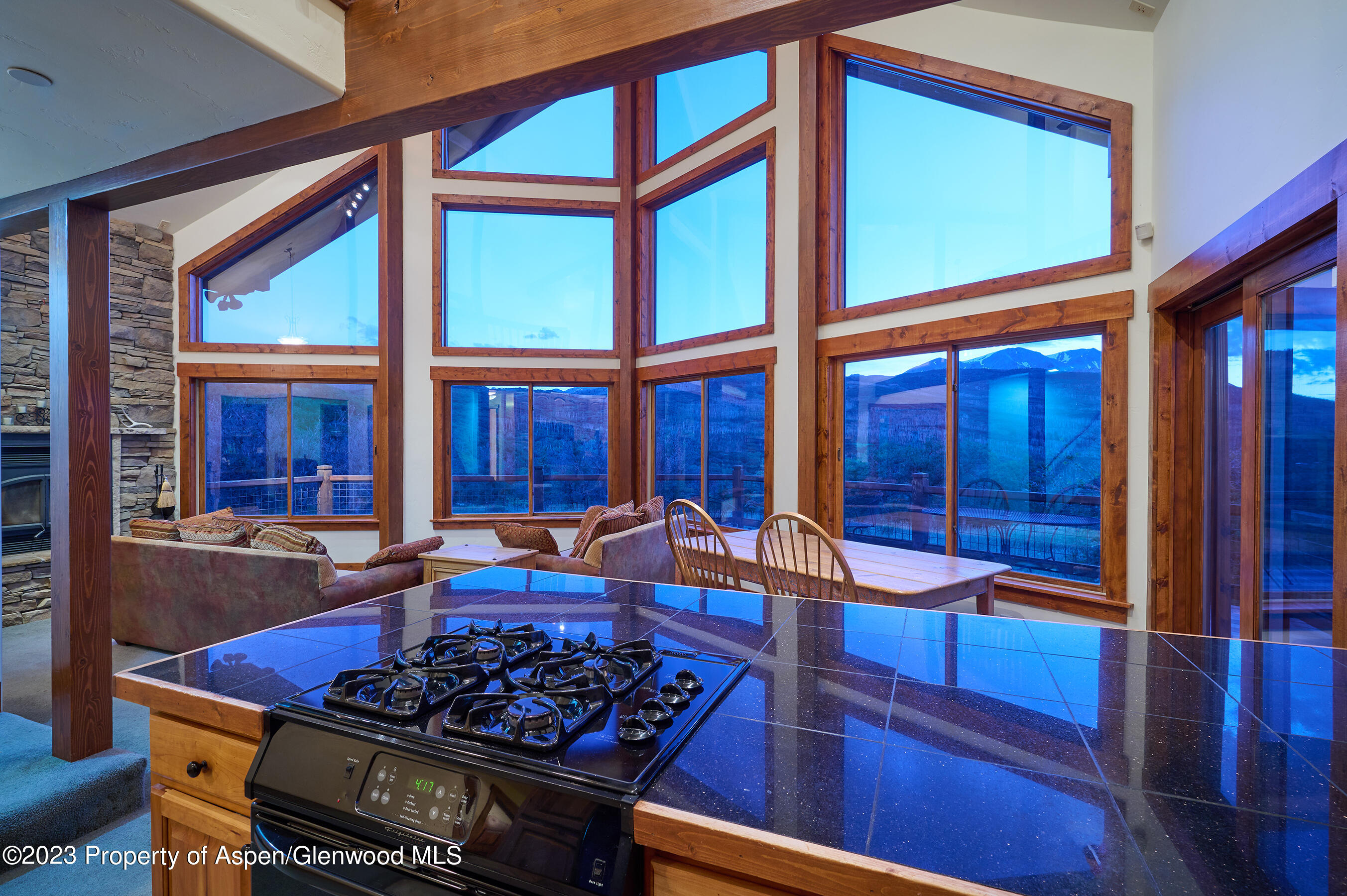 4001 Bear Ridge Road Basalt, CO 81621 - Photo 22 of 35 a kitchen with stainless steel appliances granite countertop a stove a sink and a dining table