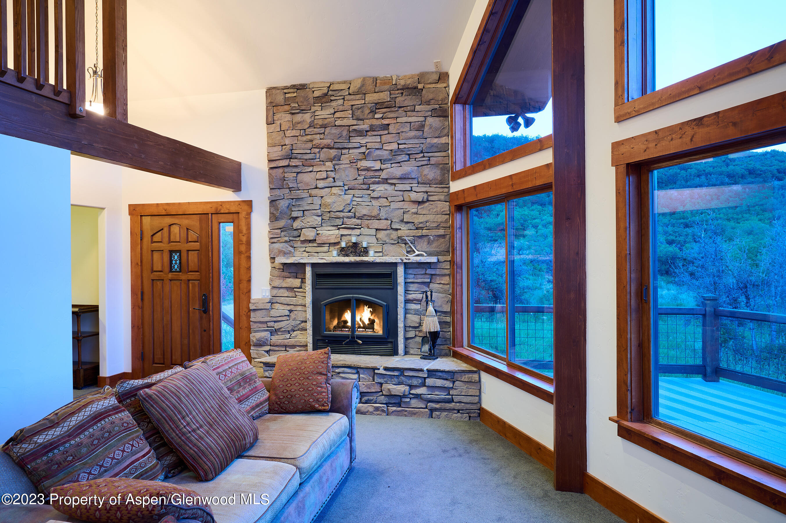 4001 Bear Ridge Road Basalt, CO 81621 - Photo 30 of 35 a living room with furniture and a fireplace