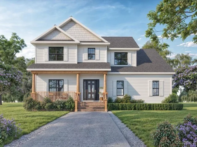 a front view of a house with a yard and trees