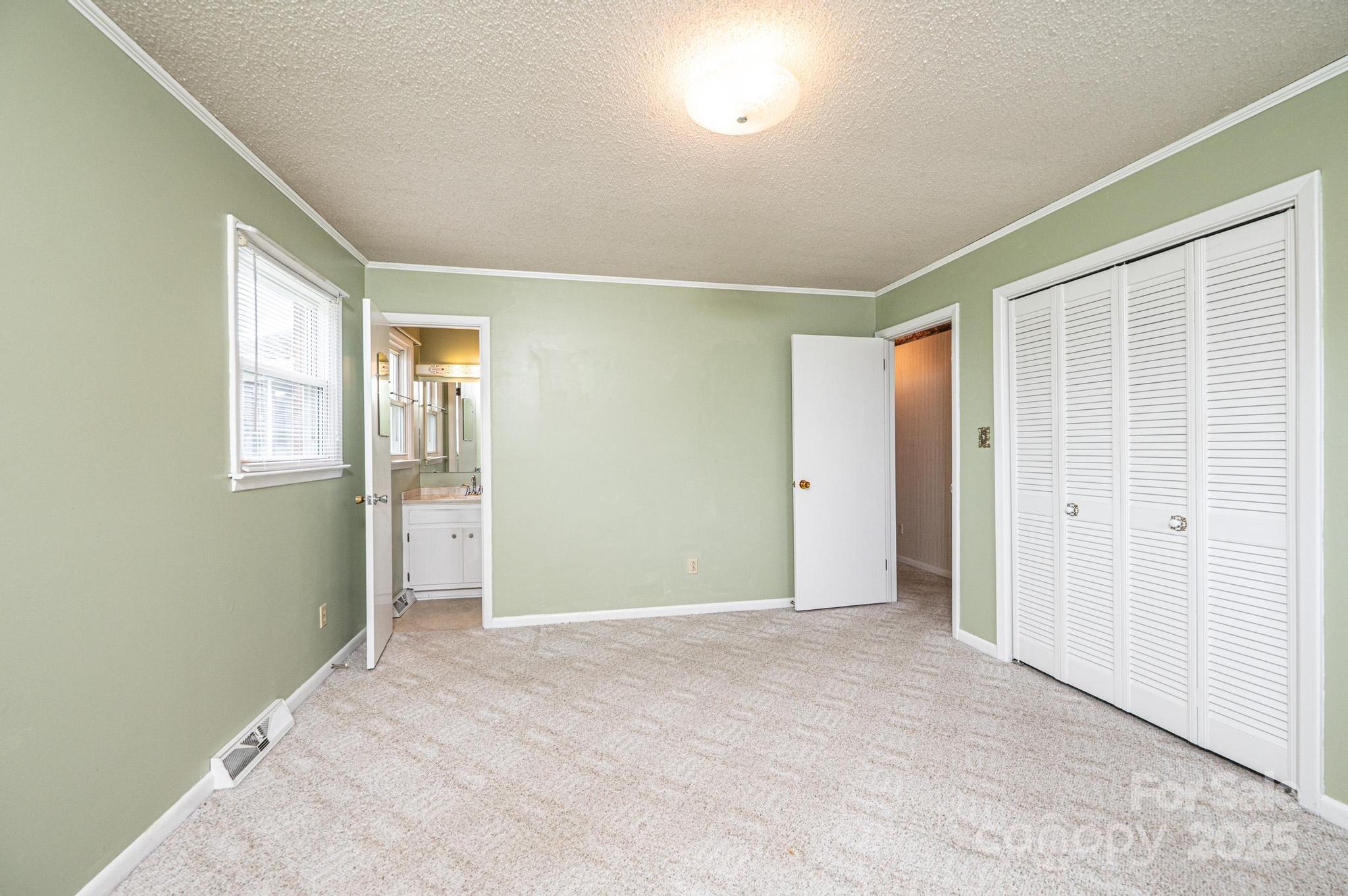 2541 Raintree Street Connelly Springs, NC 28612 - Photo 18 of 46 an empty room with windows and closet