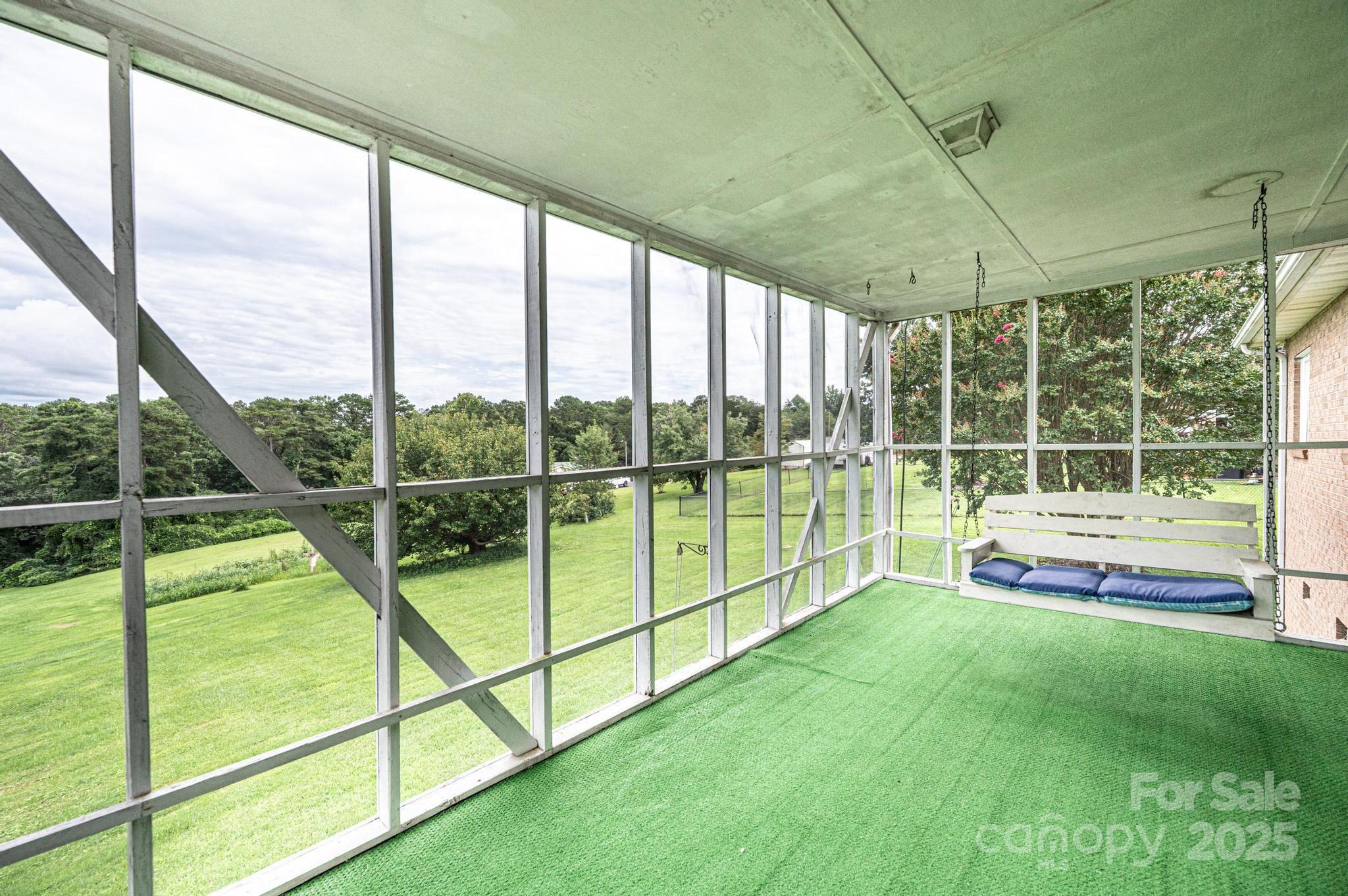 2541 Raintree Street Connelly Springs, NC 28612 - Photo 31 of 46 a view of a deck with a floor to ceiling windows and yard