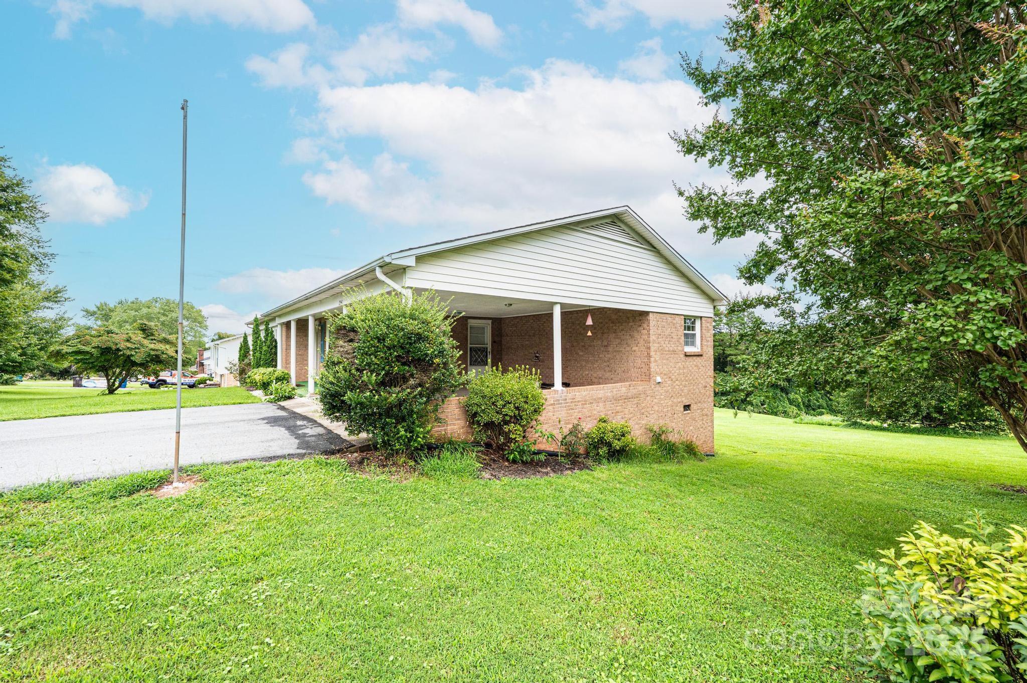 2541 Raintree Street Connelly Springs, NC 28612 - Photo 34 of 46 a front view of house with yard and green space