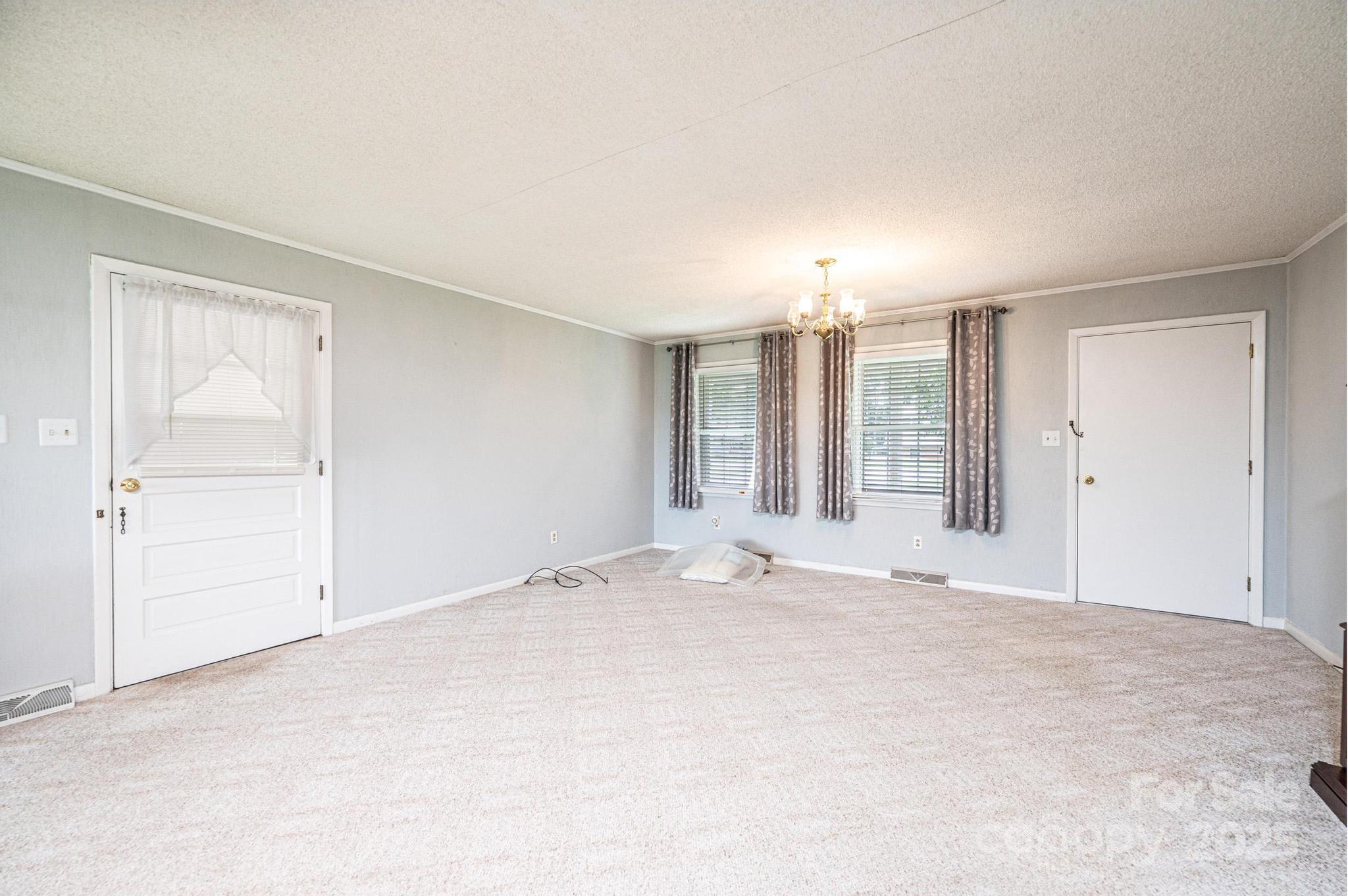 2541 Raintree Street Connelly Springs, NC 28612 - Photo 9 of 46 a view of an empty room with a window