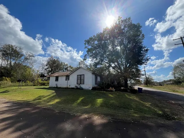 a view of a town with large trees
