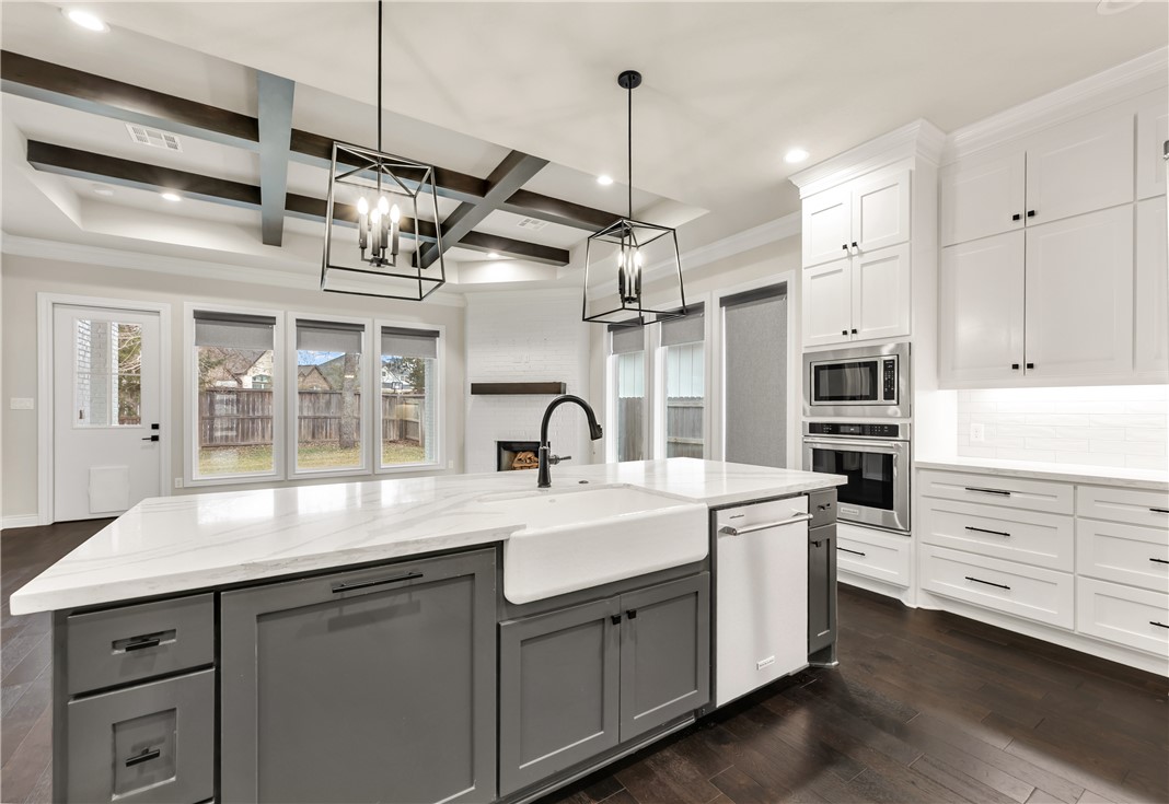 1736 Blanco Bend Drive College Station, TX 77845 - Photo 12 of 36 a kitchen with a sink stainless steel appliances and cabinets