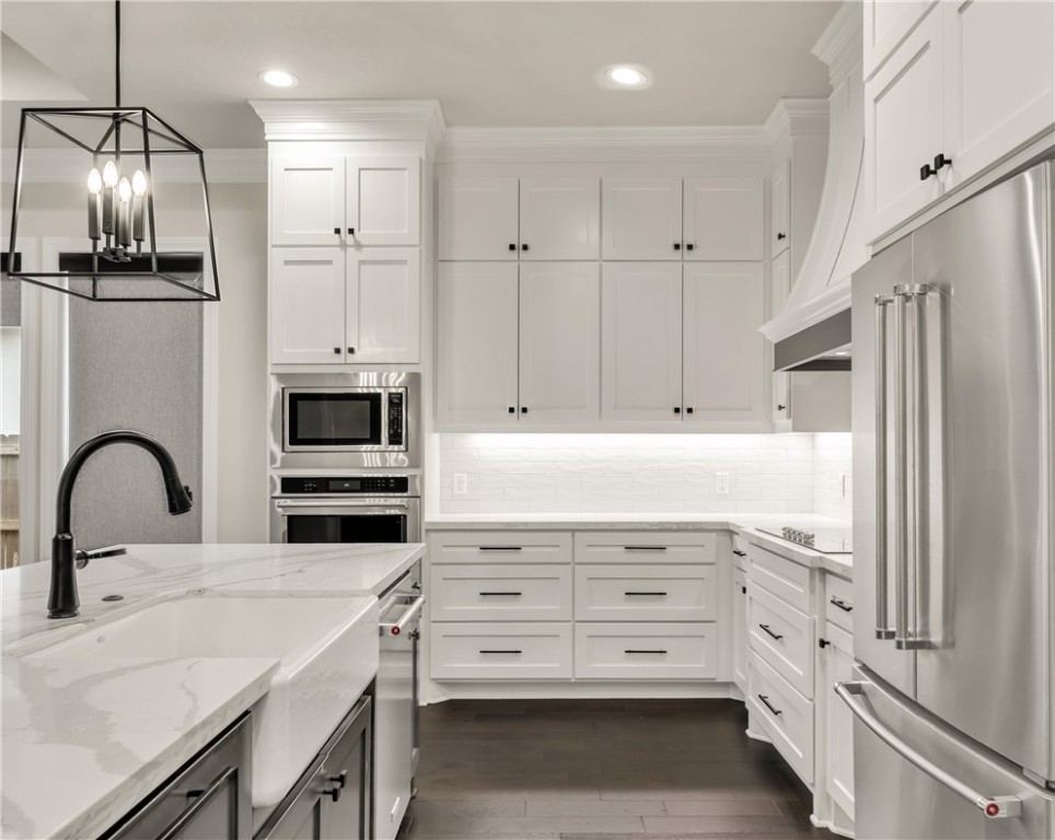 1736 Blanco Bend Drive College Station, TX 77845 - Photo 13 of 36 a kitchen with appliances a sink and cabinets
