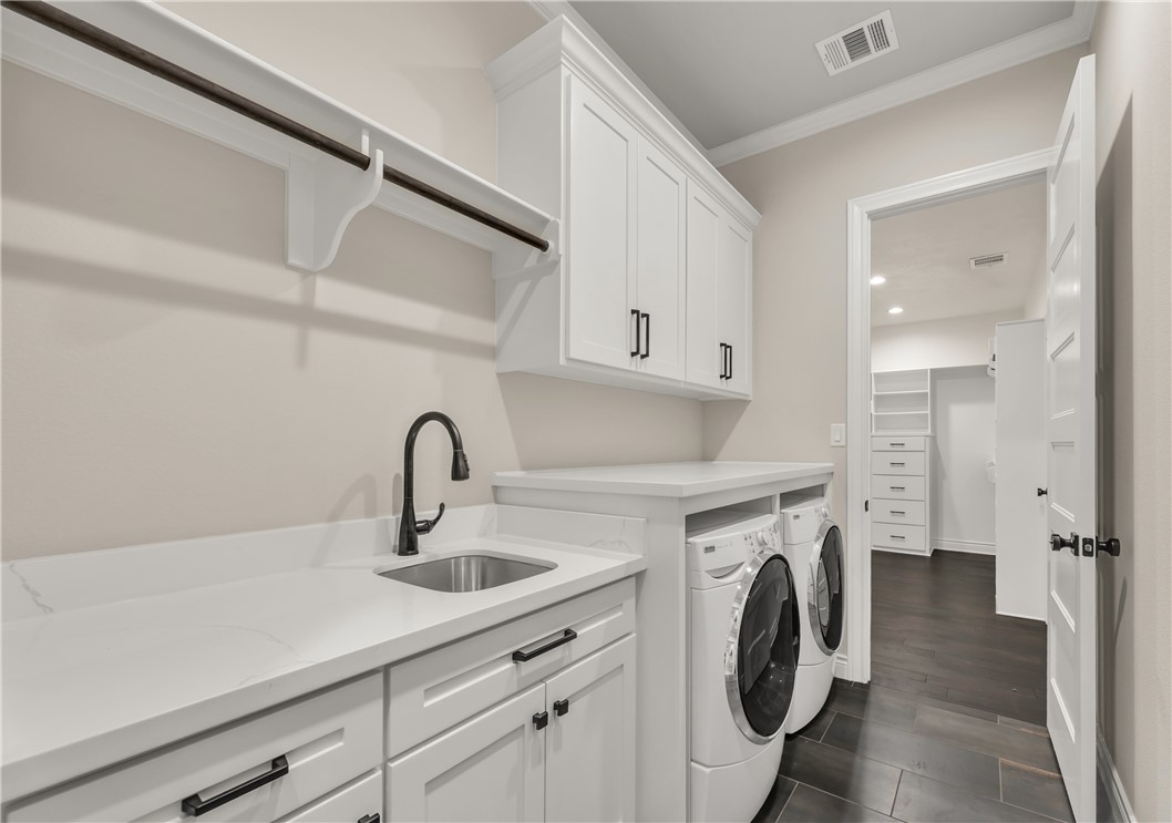 1736 Blanco Bend Drive College Station, TX 77845 - Photo 15 of 36 a view of a kitchen with sink washer and dryer