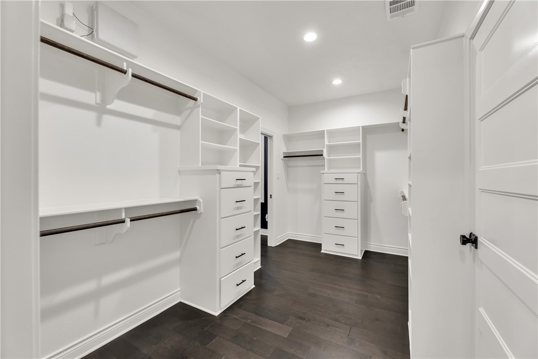 1736 Blanco Bend Drive College Station, TX 77845 - Photo 16 of 36 a view of walk in closet with wooden floor