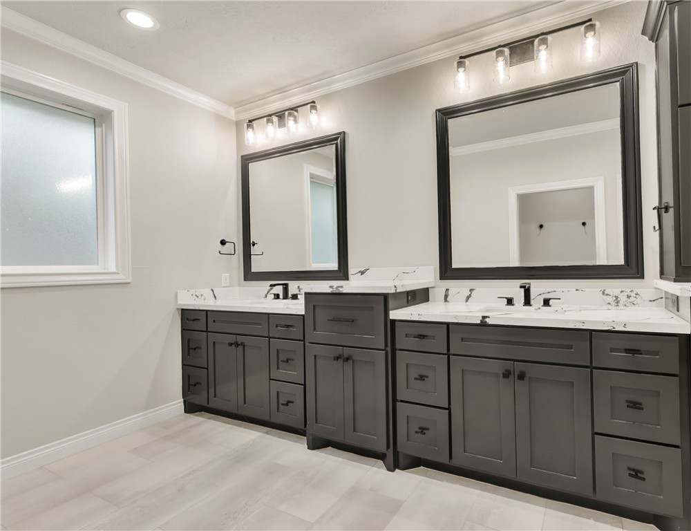 1736 Blanco Bend Drive College Station, TX 77845 - Photo 21 of 36 a bathroom with a double vanity sink and mirror