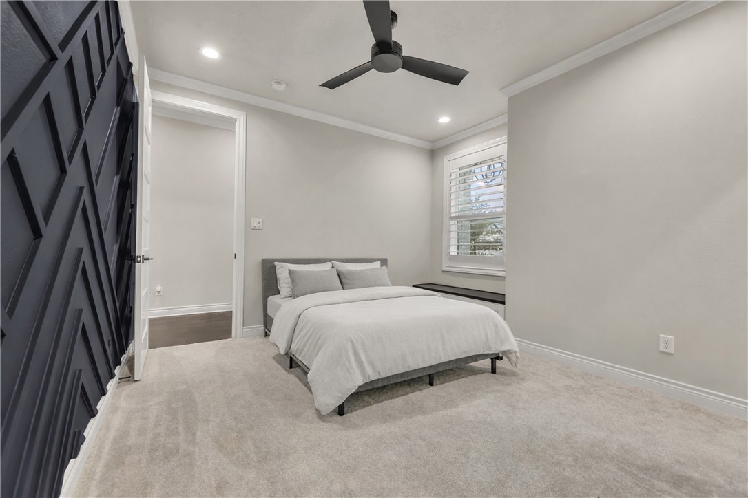 1736 Blanco Bend Drive College Station, TX 77845 - Photo 25 of 36 a spacious bedroom with a bed and a chandelier