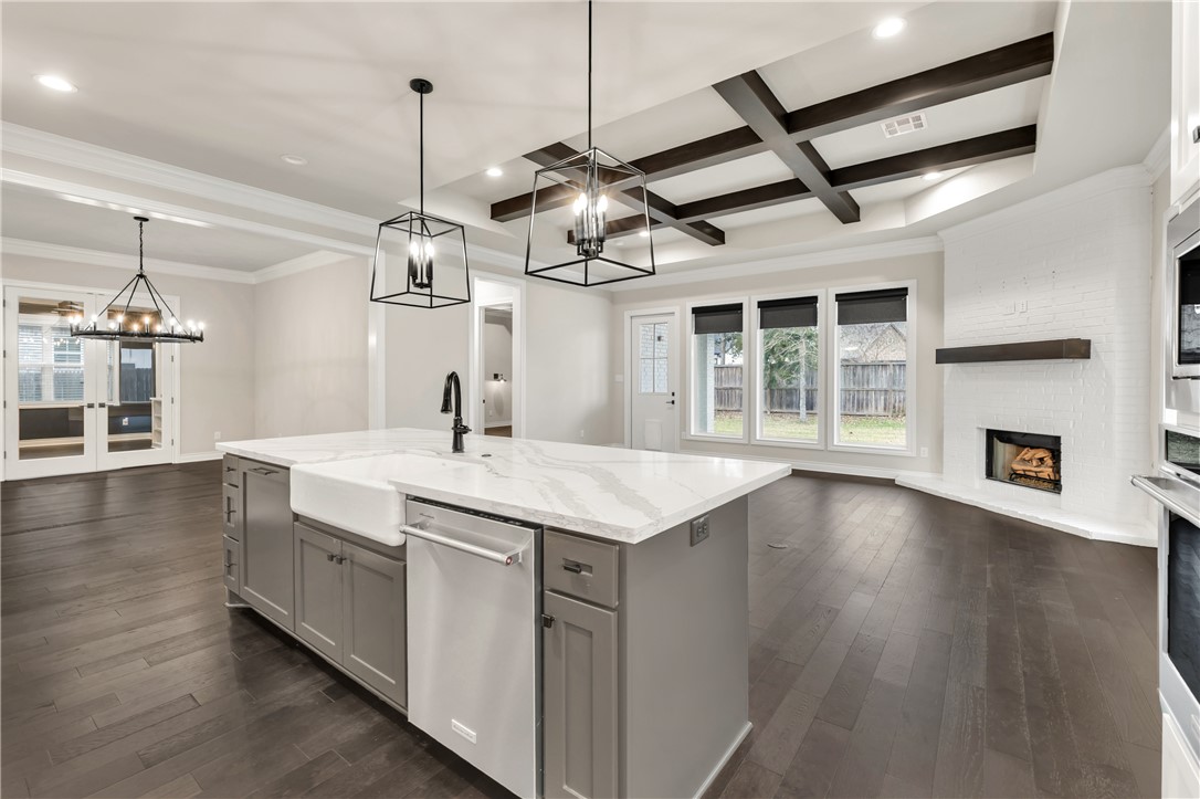1736 Blanco Bend Drive College Station, TX 77845 - Photo 6 of 36 a kitchen with a sink and chandelier
