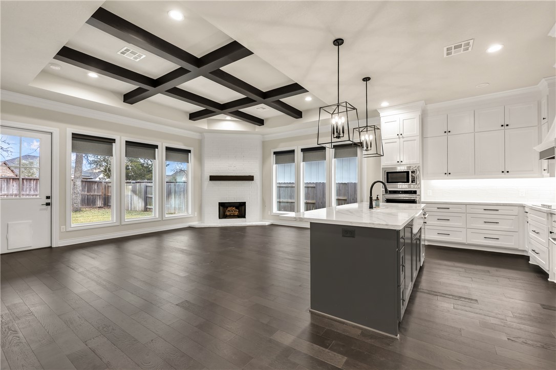 1736 Blanco Bend Drive College Station, TX 77845 - Photo 8 of 36 a kitchen with stainless steel appliances granite countertop a sink and cabinets