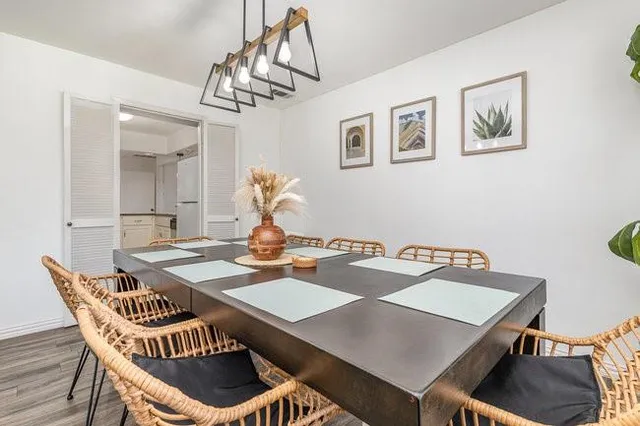 a view of a dining room furniture and chandelier
