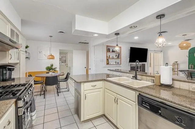 a kitchen with a sink and cabinets
