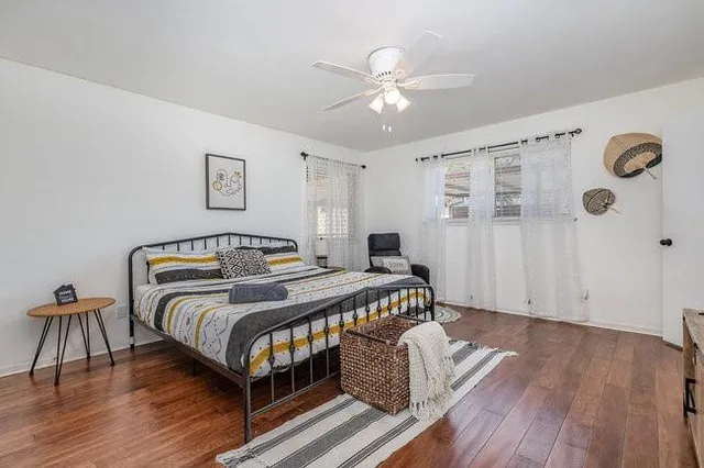 a bedroom with a bed and a table