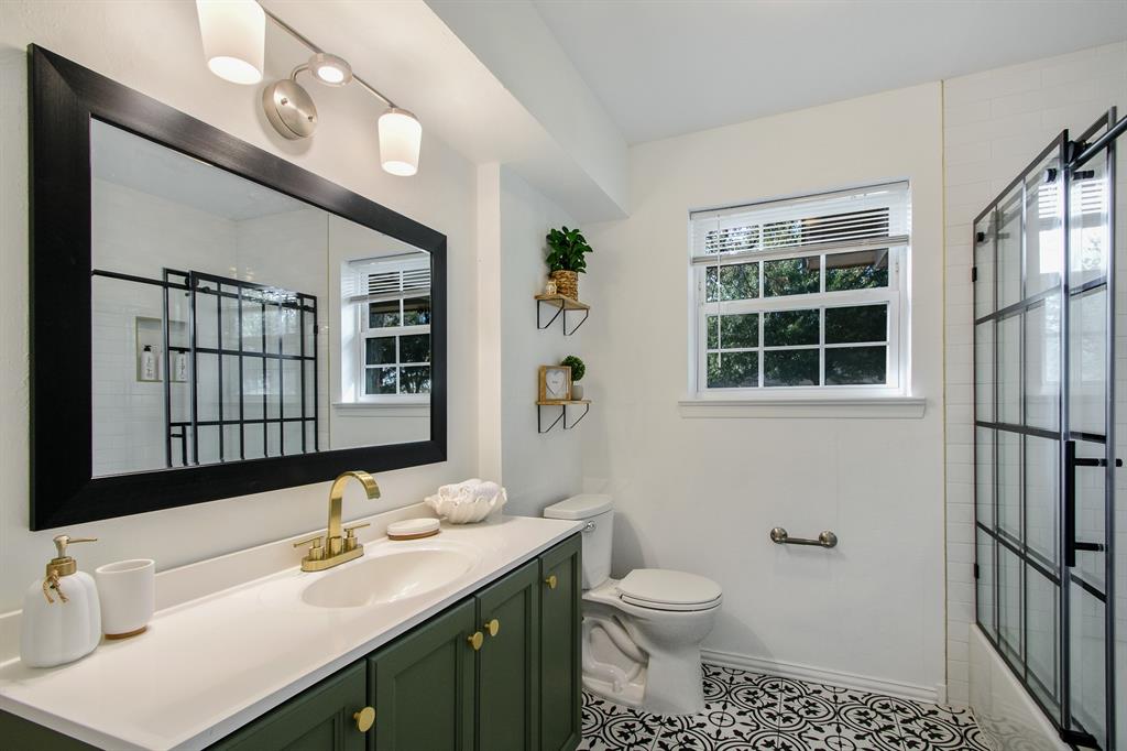 2404 Crestview Circle Irving, TX 75062 - Photo 19 of 39 a bathroom with a sink toilet and shower