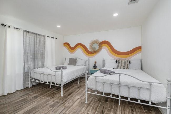 2404 Crestview Circle Irving, TX 75062 - Photo 23 of 39 a bedroom with bed and a window