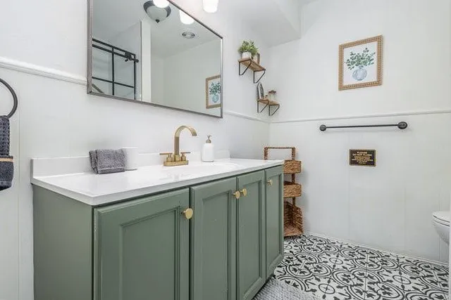 a kitchen with a sink and cabinets