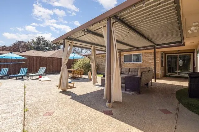 a view of a backyard with a patio