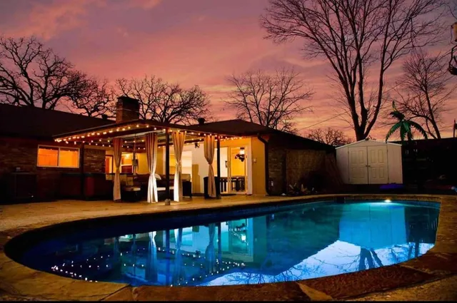 a view of a swimming pool with a patio