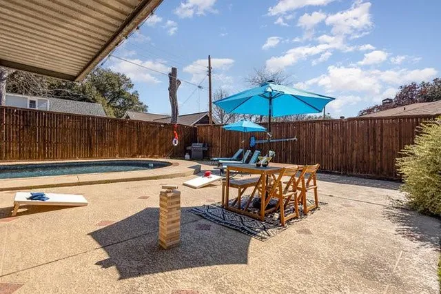 a view of swimming pool with outdoor seating