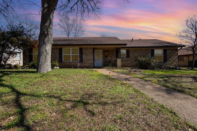 2404 Crestview Circle Irving, TX 75062 - Photo 6 of 39 a view of a house with a yard