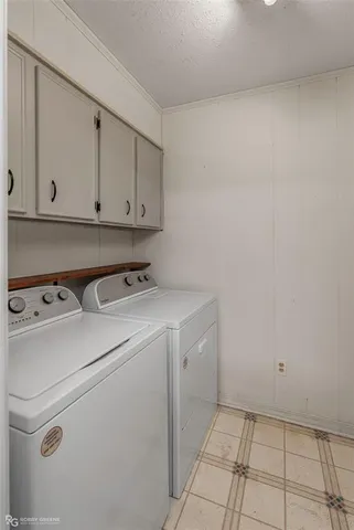 a view of storage and utility room with washer and dryer