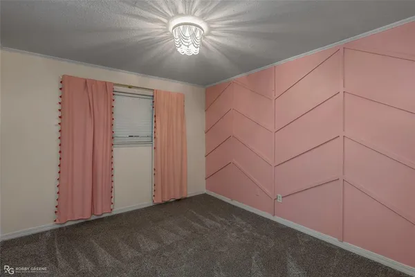 an empty room with a ceiling fan
